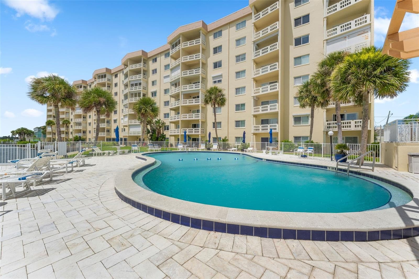 Heated pool view to the north - 3606 S PENINSULA DR #103, PORT ORANGE