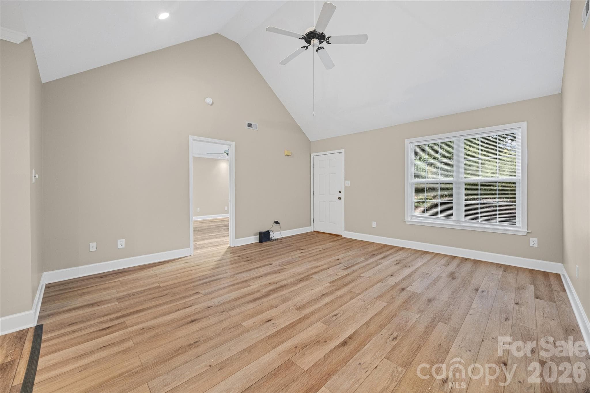 Livingroom view from the dining area showing entry to primary bedroom - 5408 Mallard Lane, Gastonia