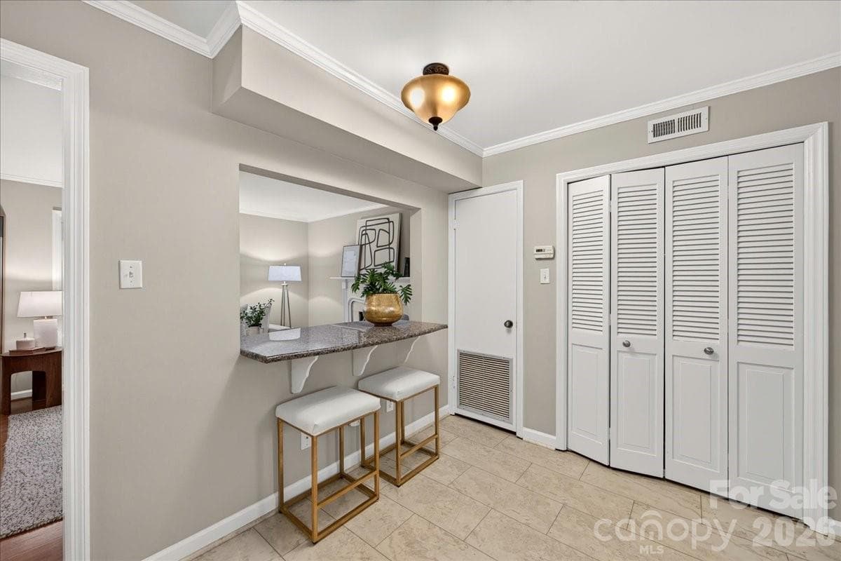 Breakfast bar and laundry closet - 1700 Roxborough Road, Charlotte