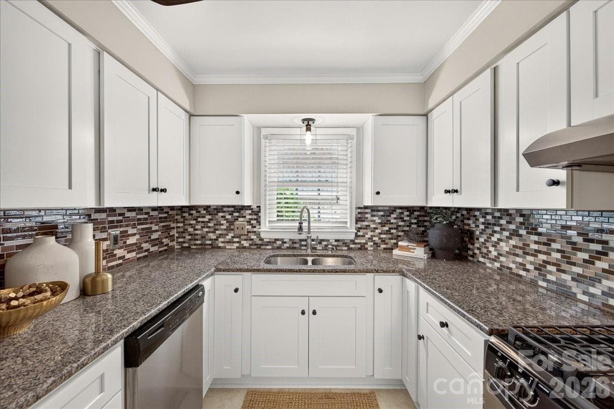 Kitchen window overlooks Trianon - 1700 Roxborough Road, Charlotte