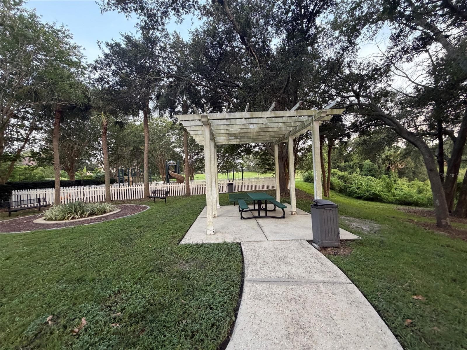Pergola overlooking well manicured grounds. - 483 VIA TUSCANY LOOP, LAKE MARY