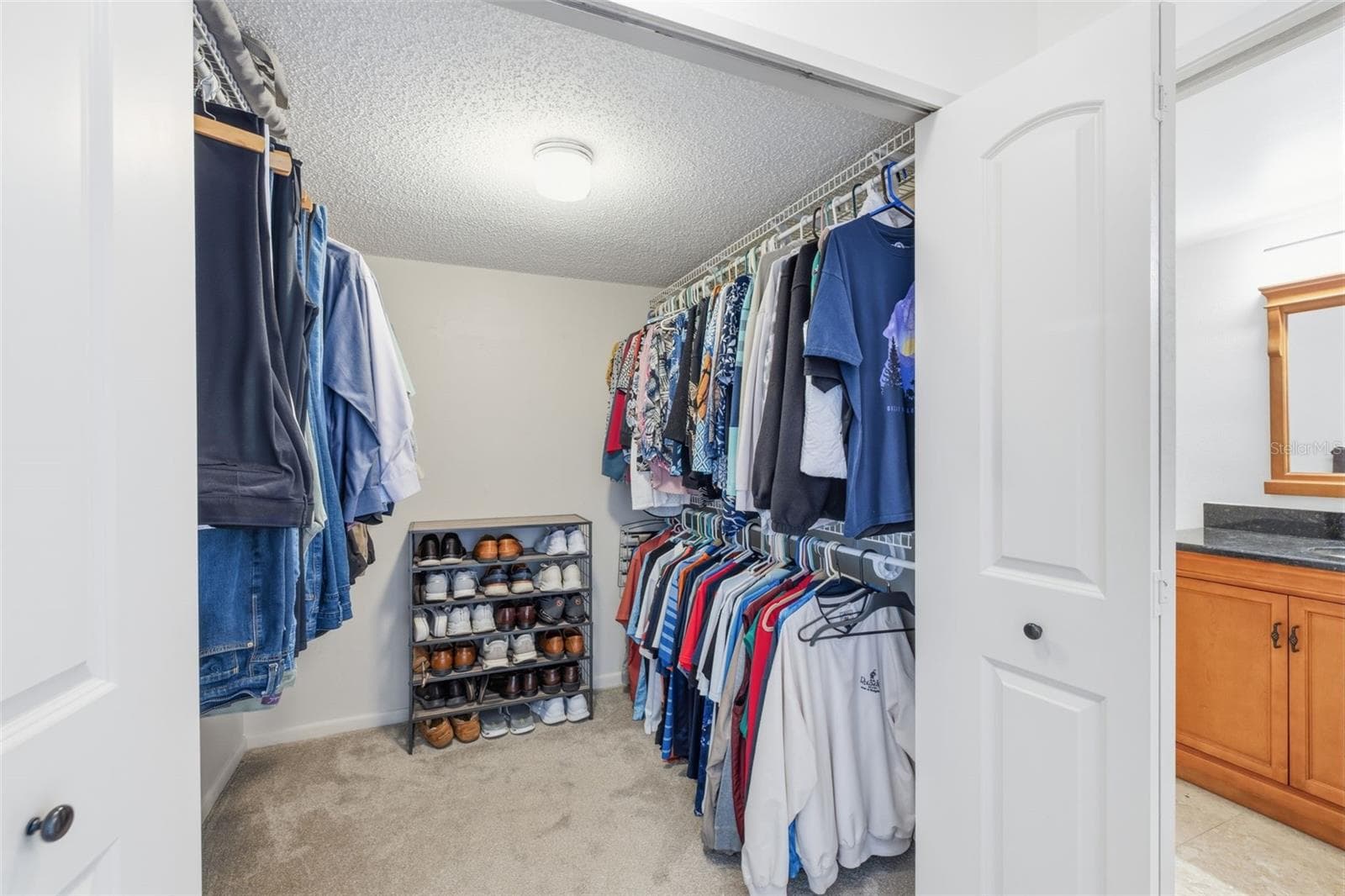 Primary bedroom walk in closet - 9425 BLIND PASS RD #705, ST PETE BEACH