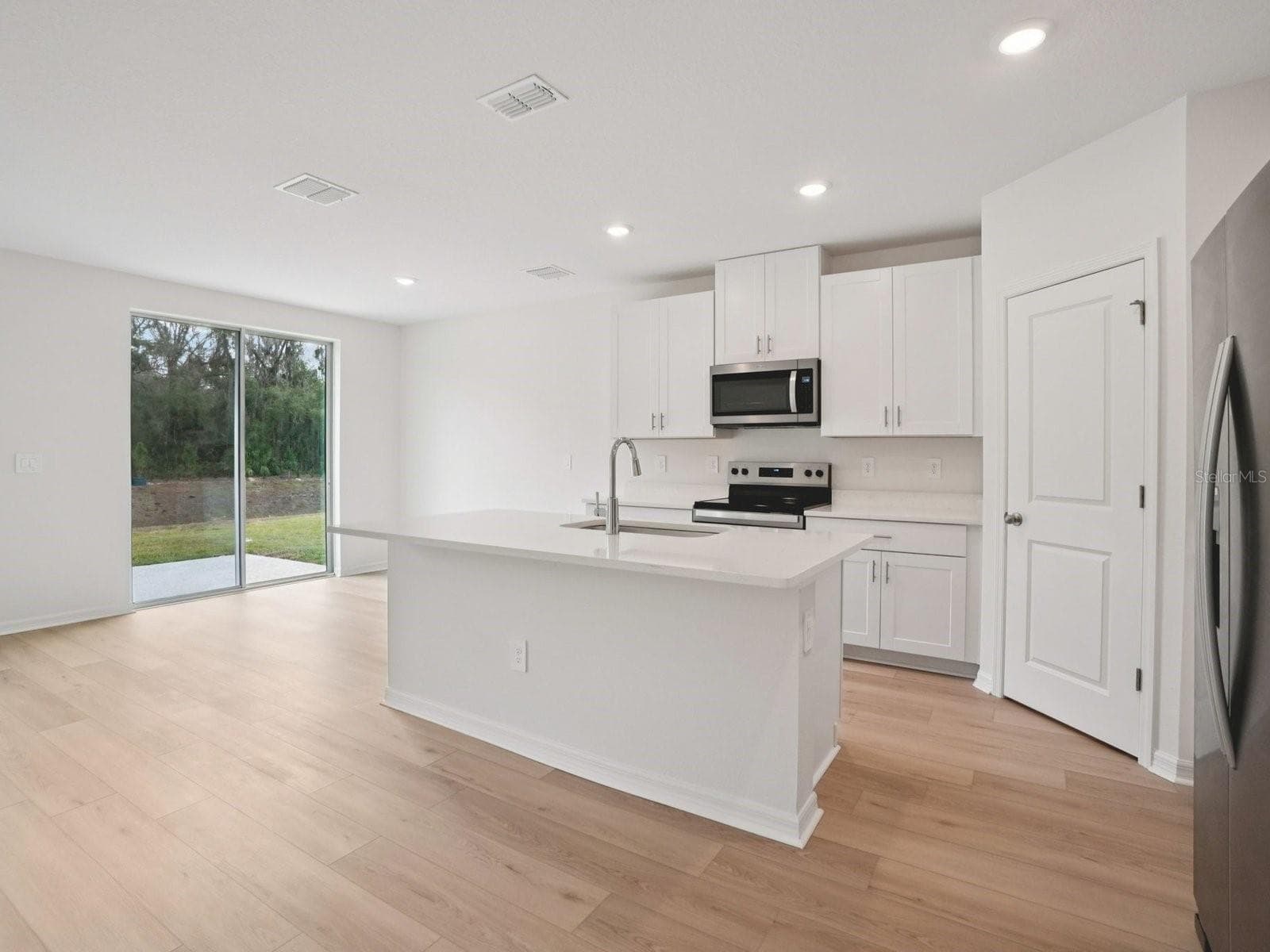 Photo is not of the actual home, but is an inspirational photo of builder’s model home and may depict options, furnishings, and/or decorator features that are not included - 17661 OLIVE THORN DR, BROOKSVILLE