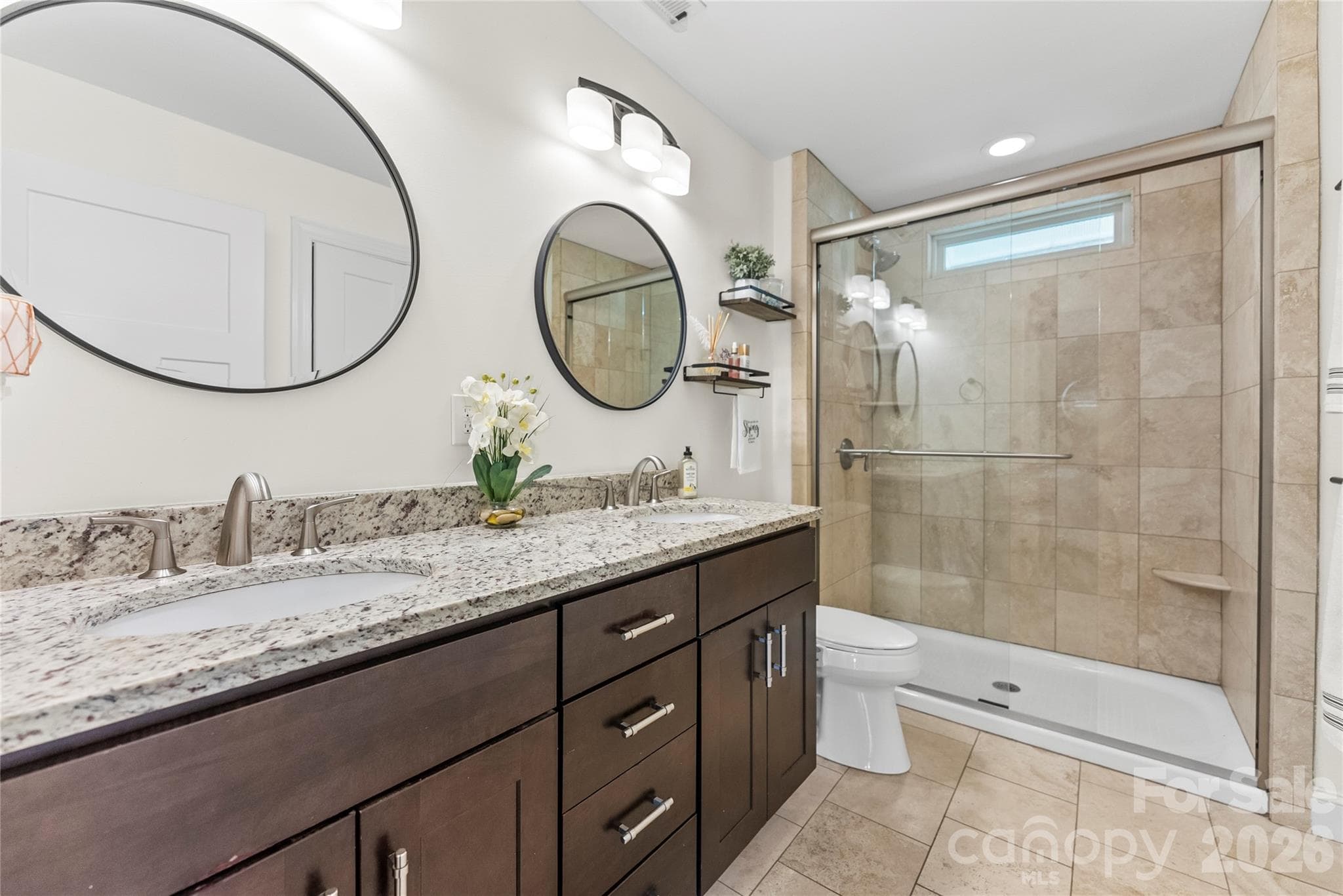 Primary bathroom with double vanity and linen closet - 118 Houston Street, Asheville