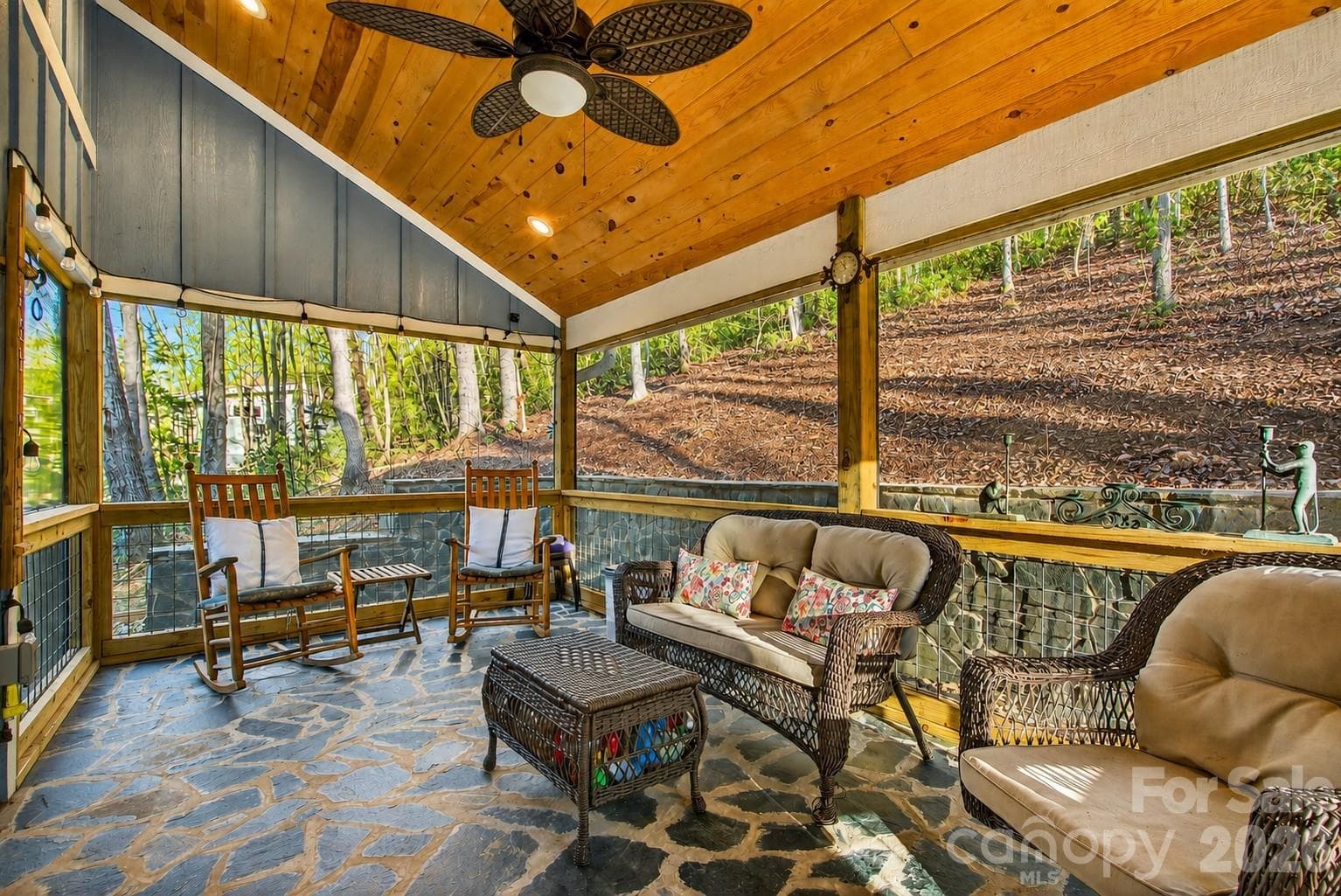 Enjoy the fresh air year round in this screened in porch off the living area. - 1413 Golf Course Road, Old Fort
