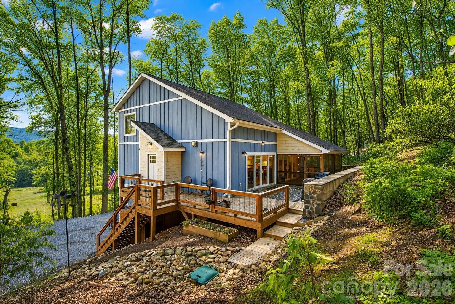 Welcome to 1413 Golf Course Road in Old Fort! Enjoy the ample deck space that flows into the screened in porch year round. - 1413 Golf Course Road, Old Fort