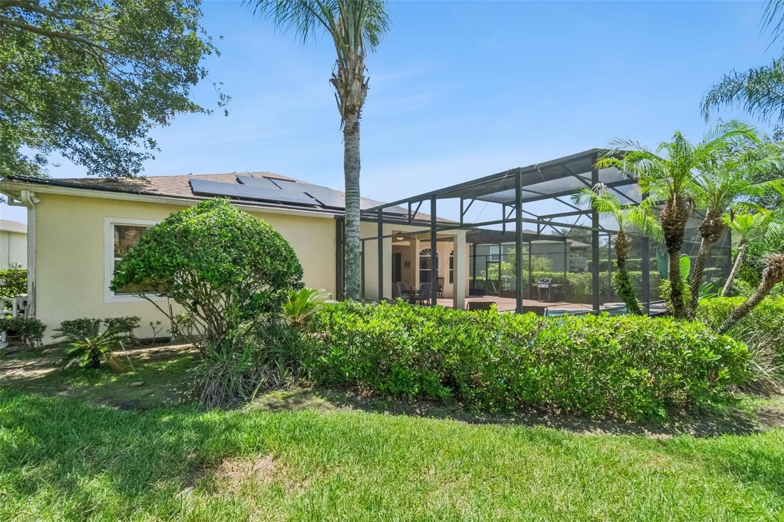 Backyard with screened pool enclosure - 1112 CALLAWAY CIR, CLERMONT