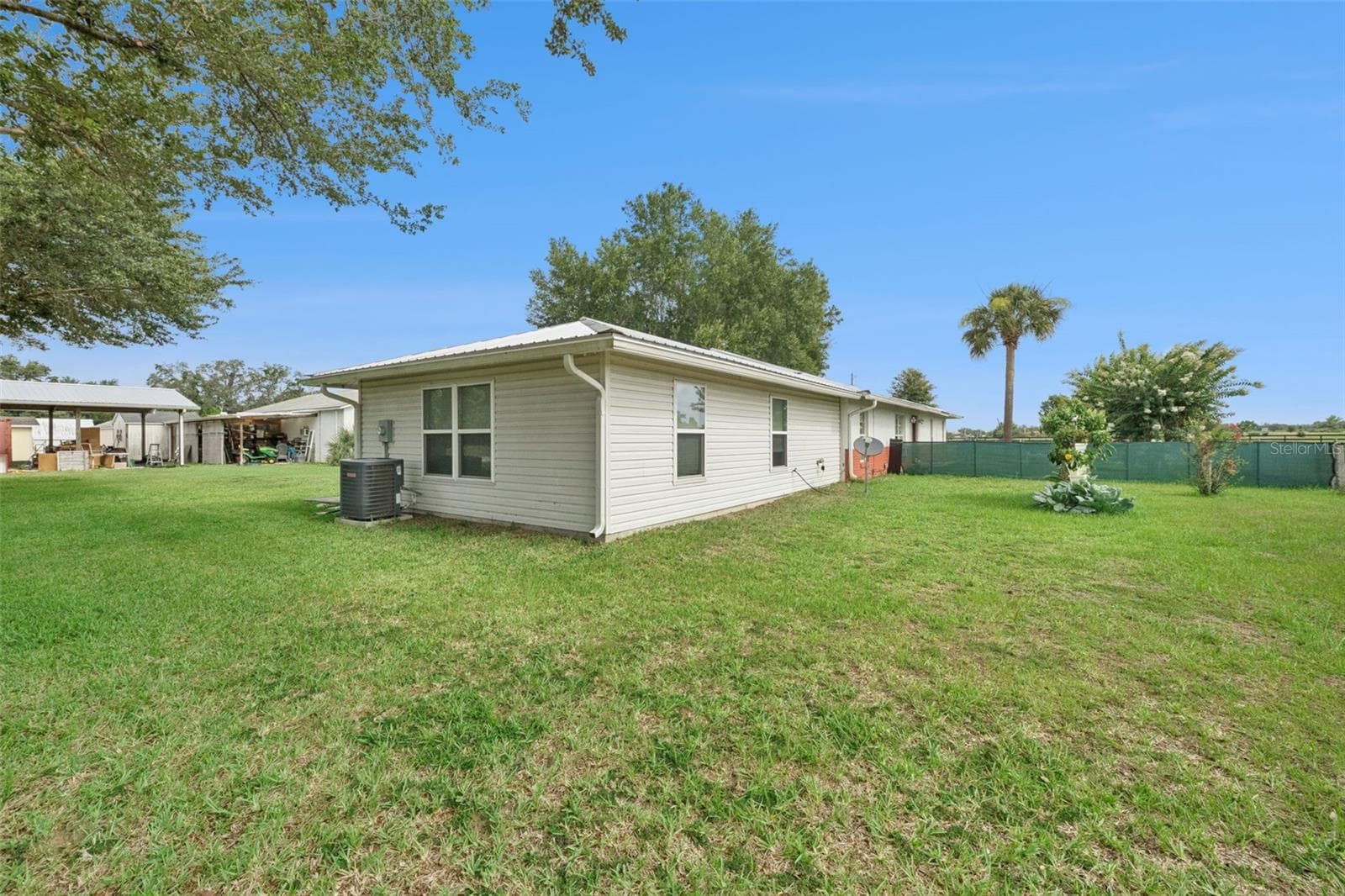 Back of the attached apartment to the main house. - 15000 S US HIGHWAY 441 HWY S, SUMMERFIELD