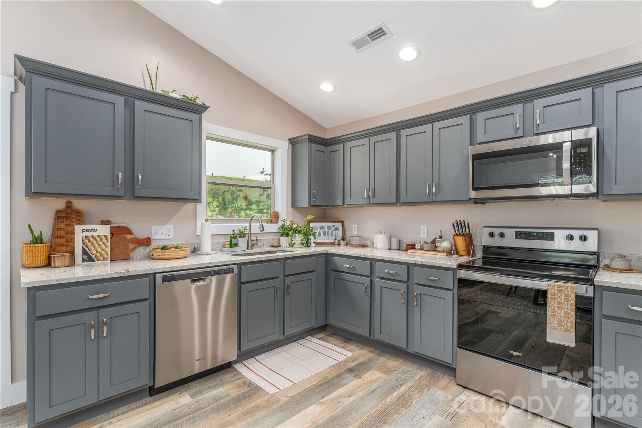 Neutral cedar shake cabinets with brushed nickel hardware - 38 Sunrise Drive, Mars Hill