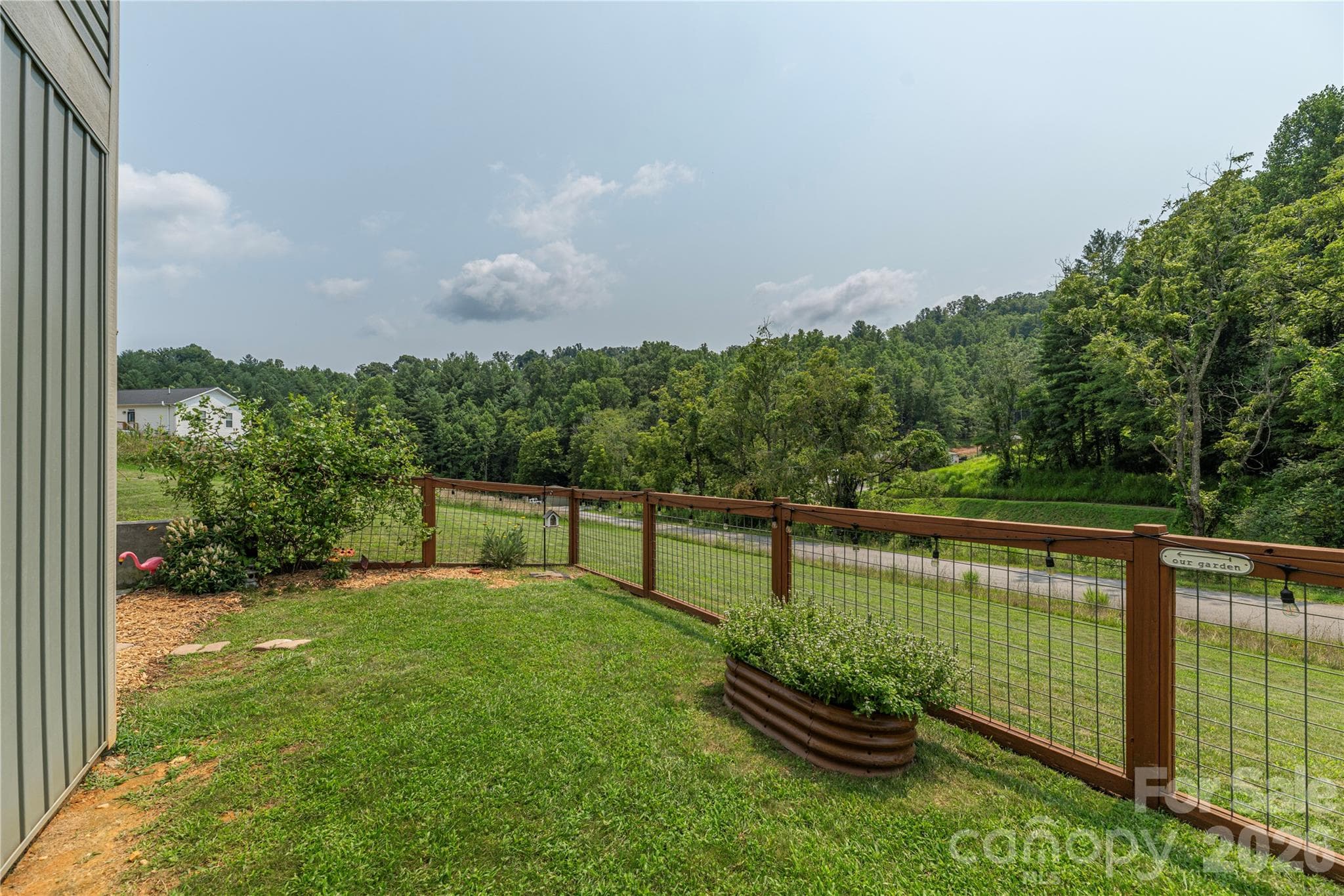 One nice section of fenced side yard for doggies - 38 Sunrise Drive, Mars Hill