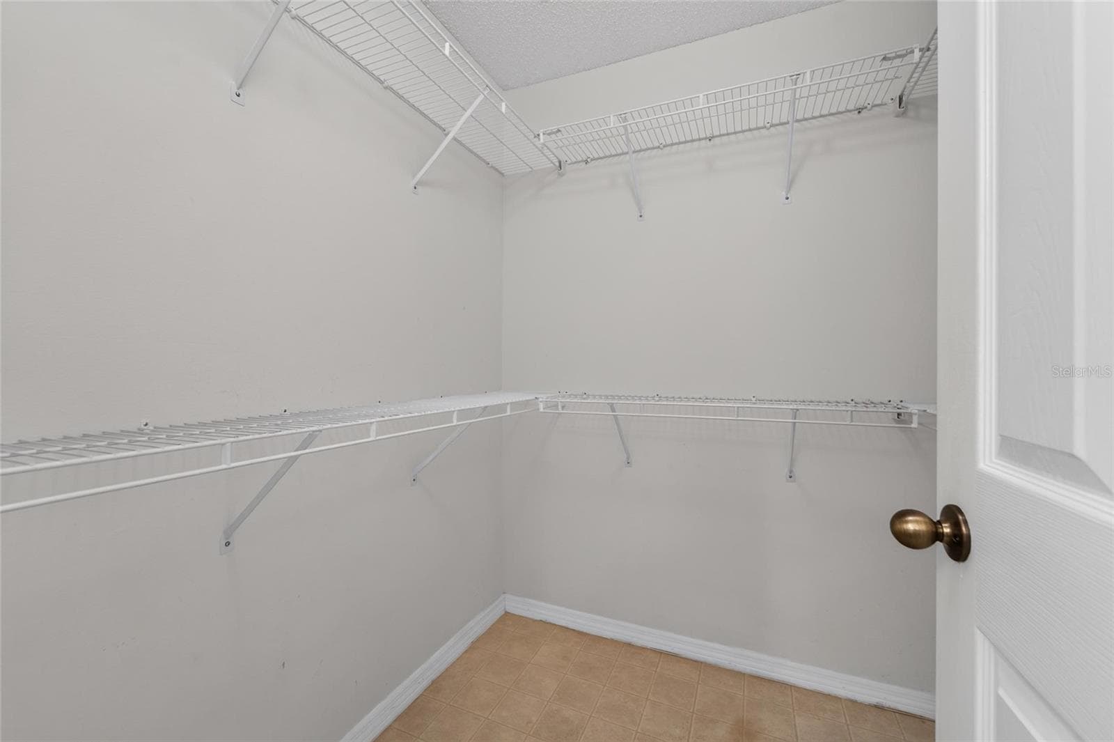 Walk-in Closet in Primary Suite - 1023 MCDANIEL ST #139, SUN CITY CENTER