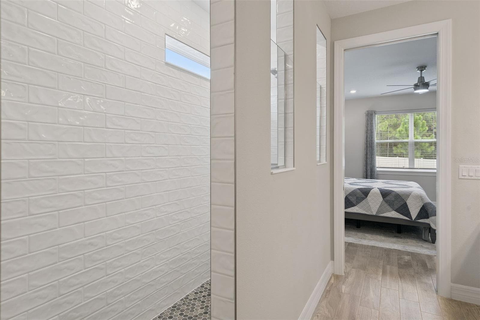 Primary Bedroom with view of walk-in shower - 2546 DEL WEBB DR, MINNEOLA