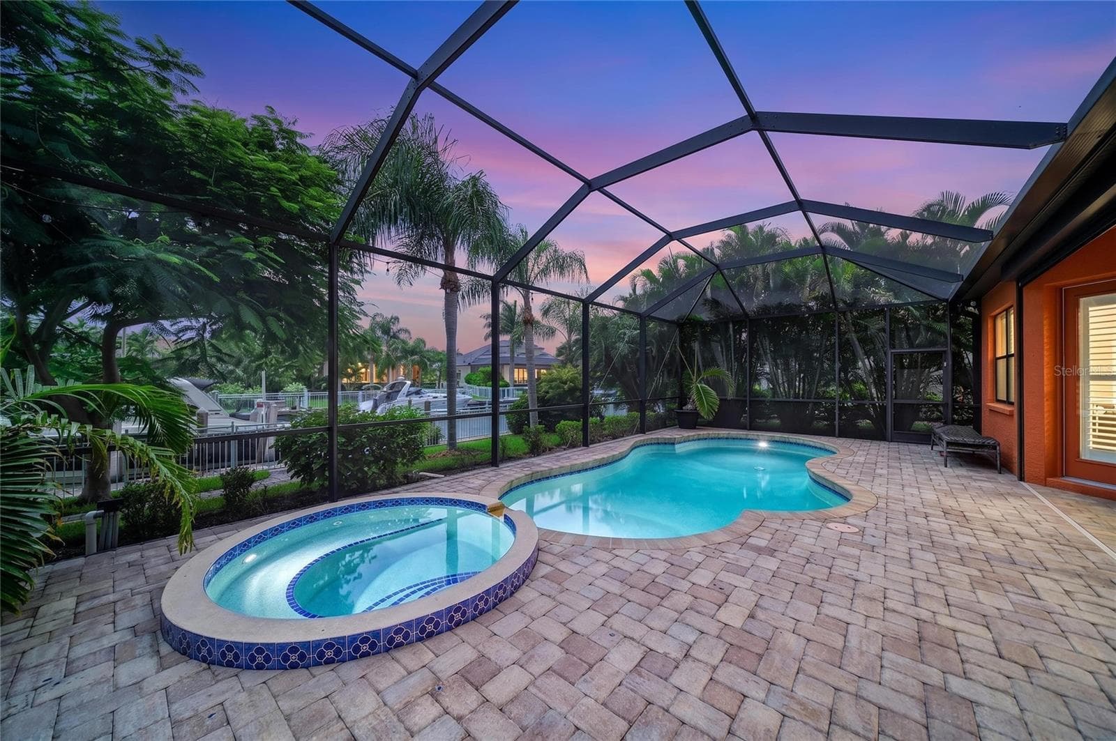 Pool area at twilight - 545 MAST DR, BRADENTON