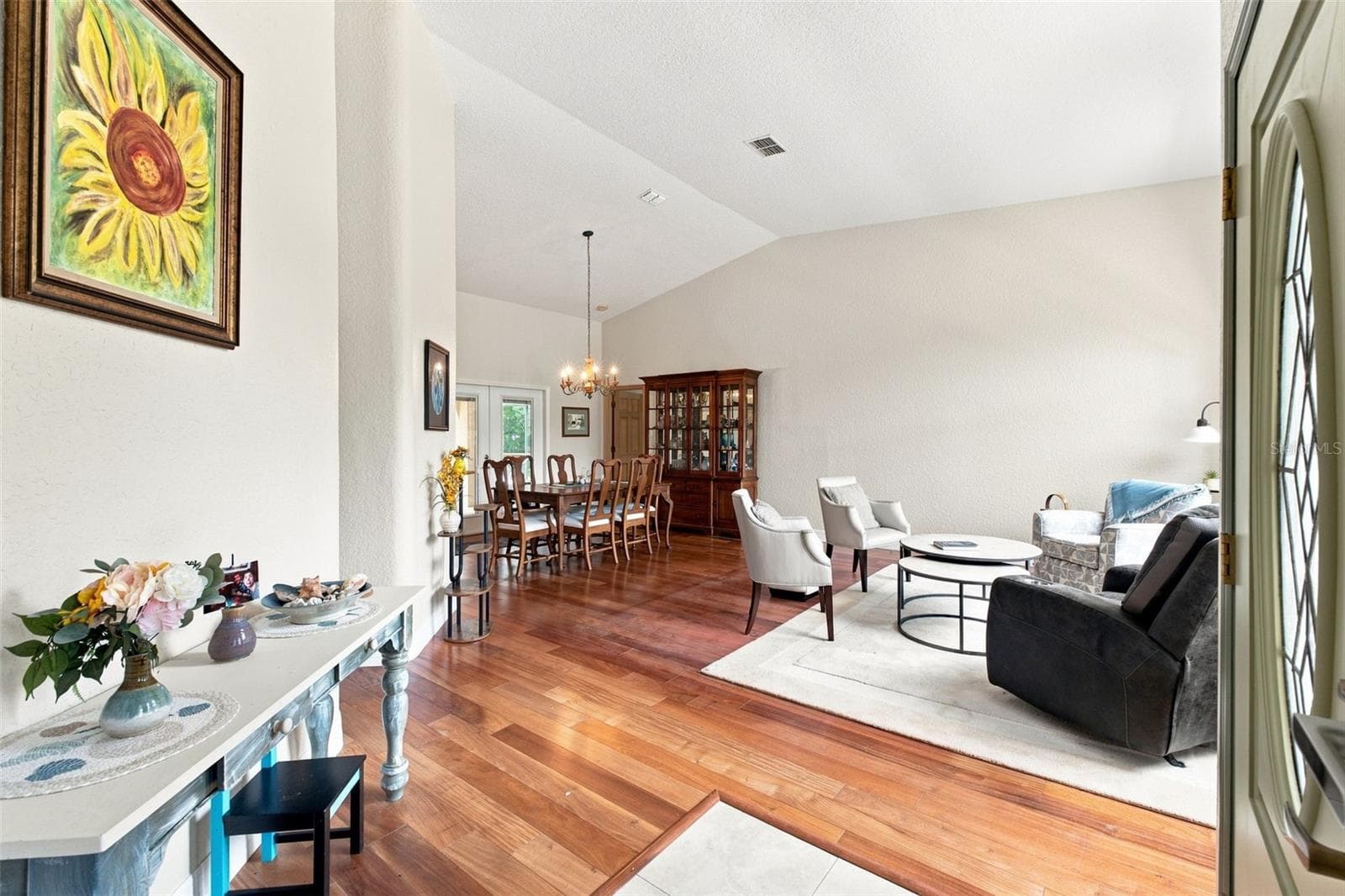vaulted ceilings and wood floor - 10307 WATERS EDGE CT, WEEKI WACHEE