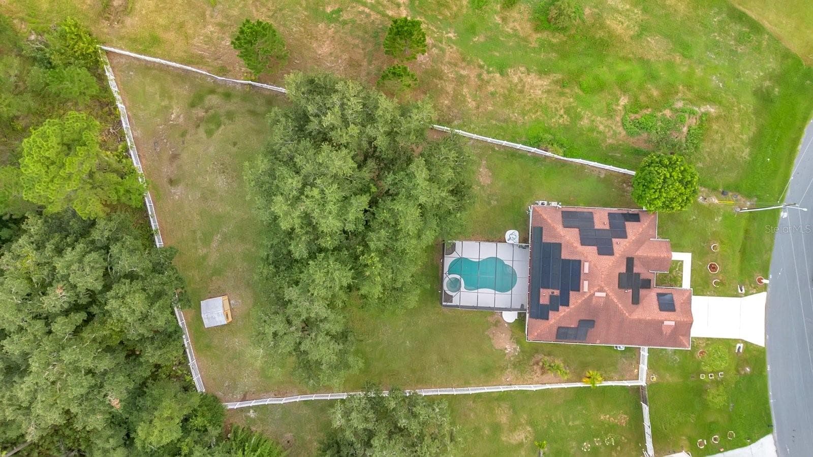 Overhead aerial view outling the expansive lot privately fenced - 46 CORDONA DR, KISSIMMEE