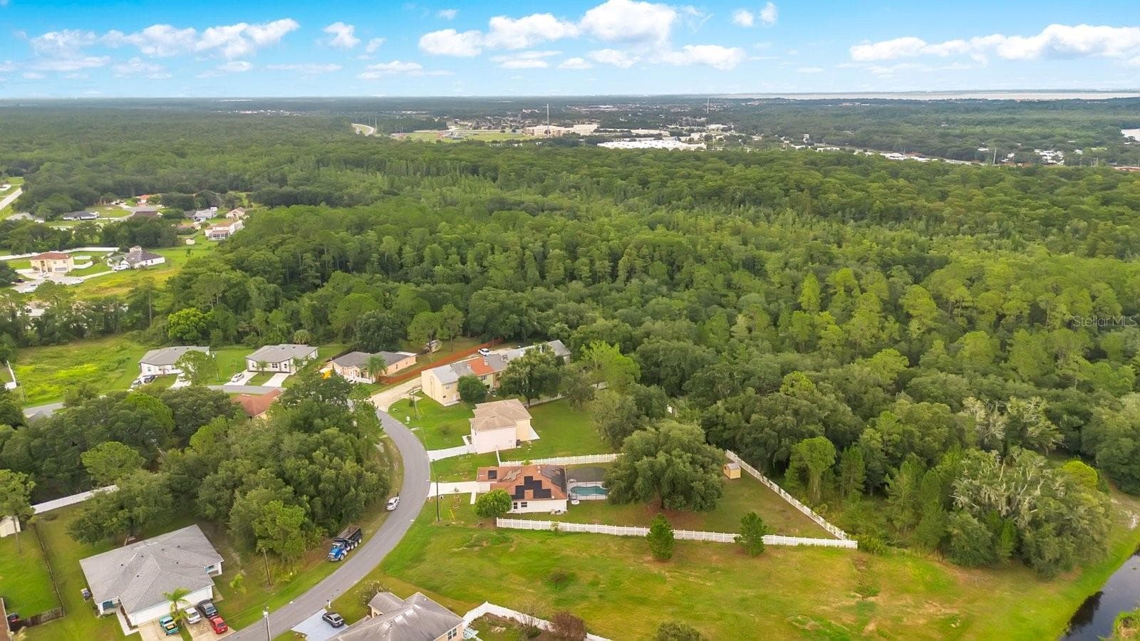 Aerial view of the surrounding homes. Look at the huge greenbelt! - 46 CORDONA DR, KISSIMMEE