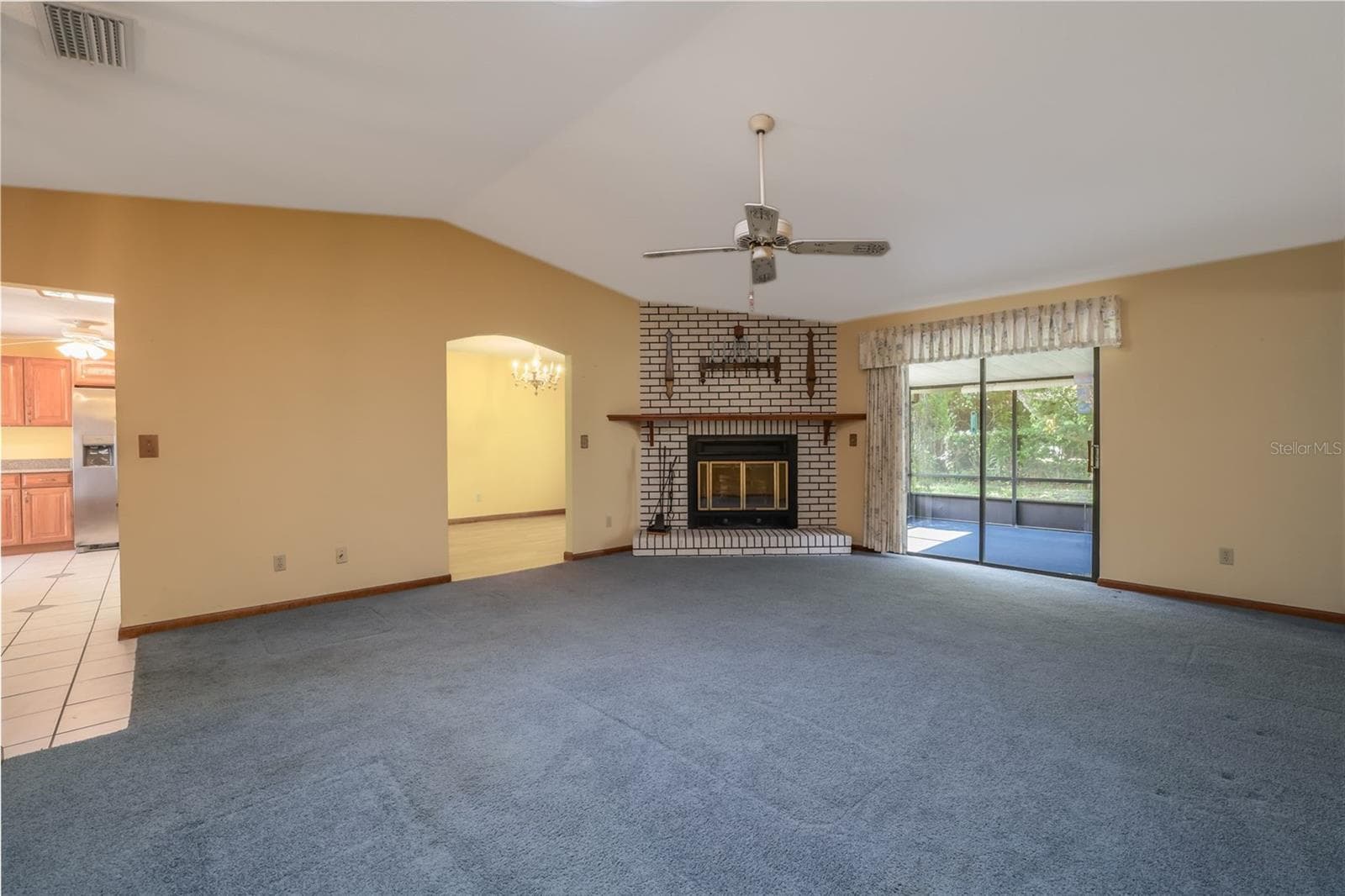 Living Room to screened Lanai - 229 GEORGETOWNE BLVD, DAYTONA BEACH