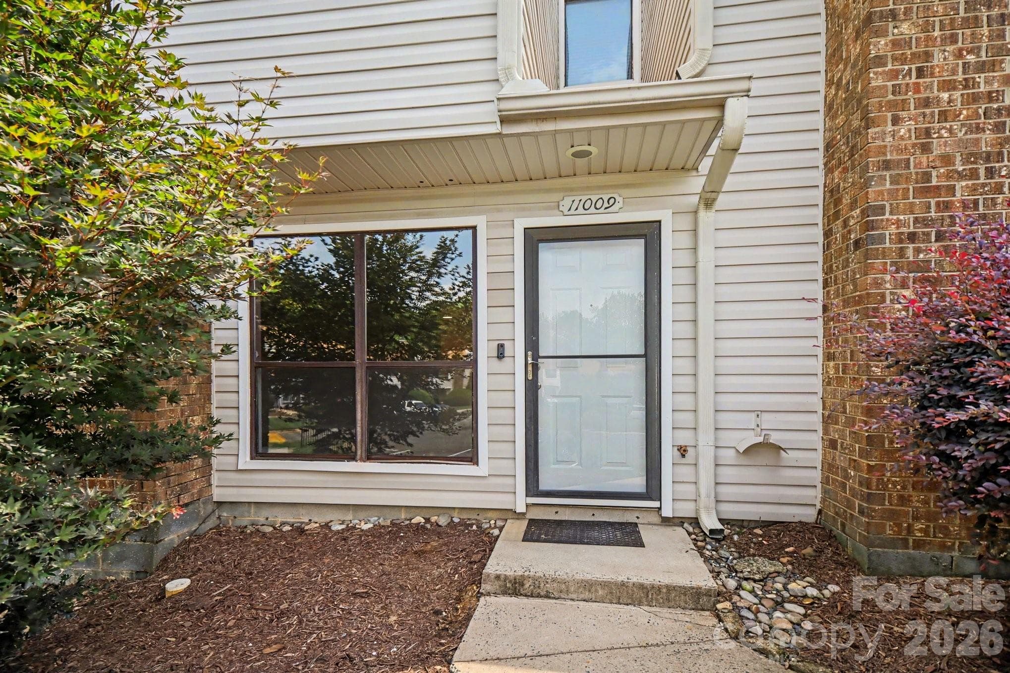 A covered entrance is always a plus - 11009 Carmel Crossing Road, Charlotte