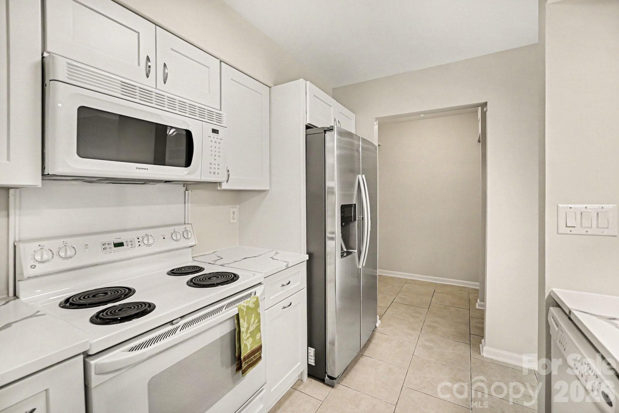 New cabinets, lots of storage.  Refrigerator with ice maker - 11009 Carmel Crossing Road, Charlotte