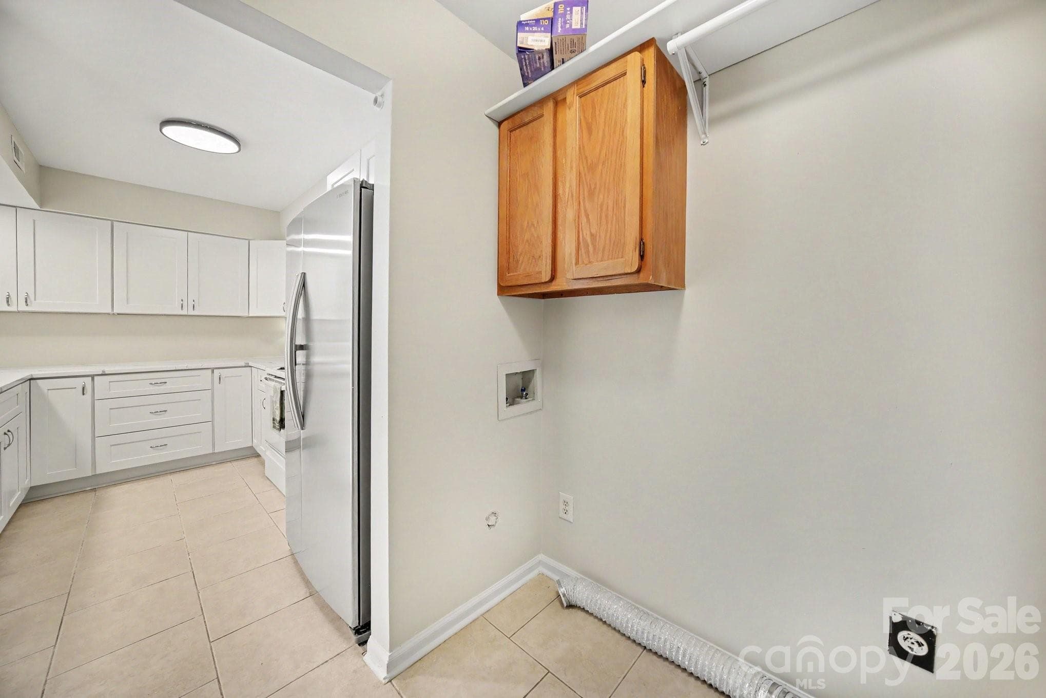 Laundry room with storage.  A barn door or folding doors can separate it from kitchen - 11009 Carmel Crossing Road, Charlotte