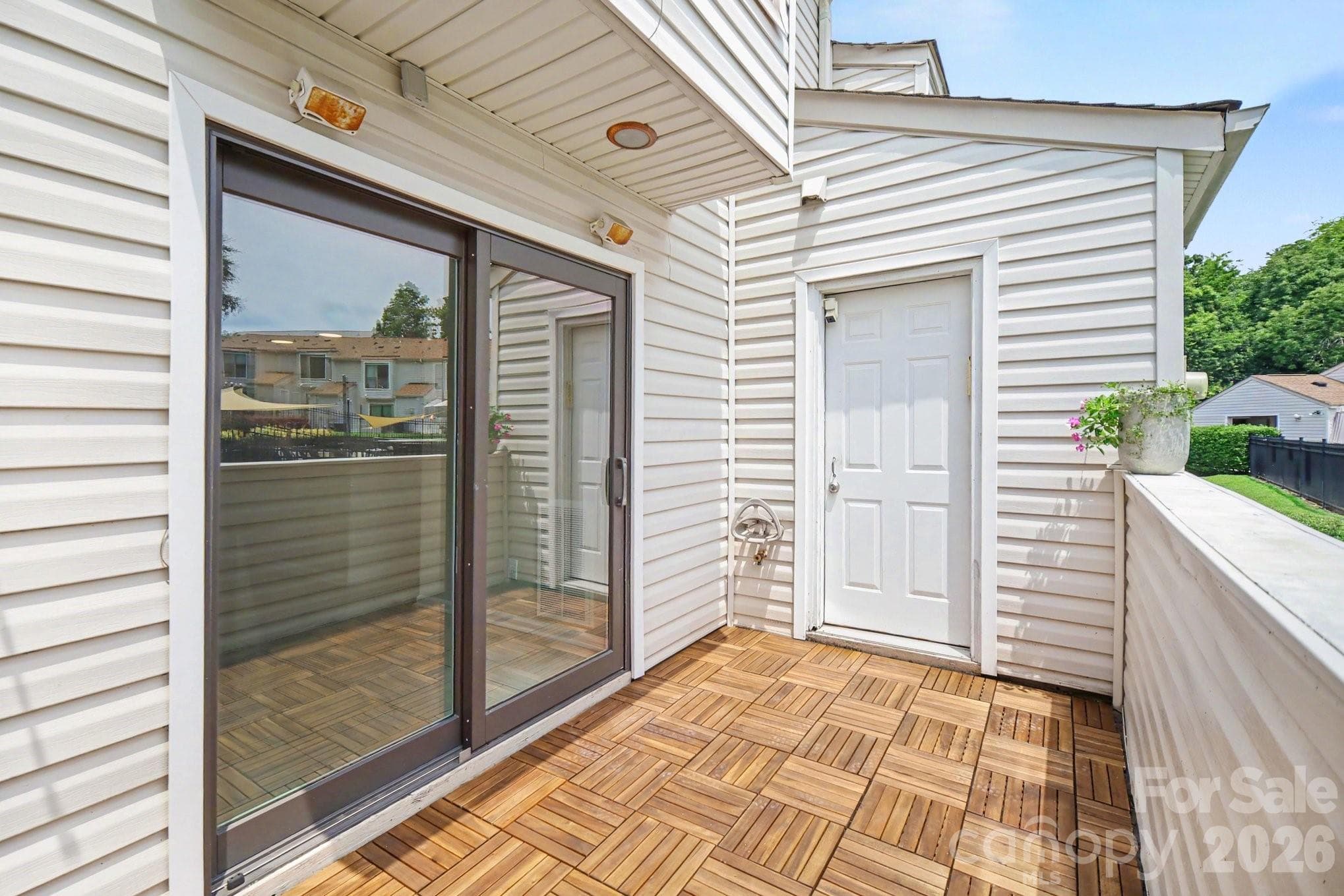 Back porch, wood floor, storage closet. Plenty of room for furniture - 11009 Carmel Crossing Road, Charlotte
