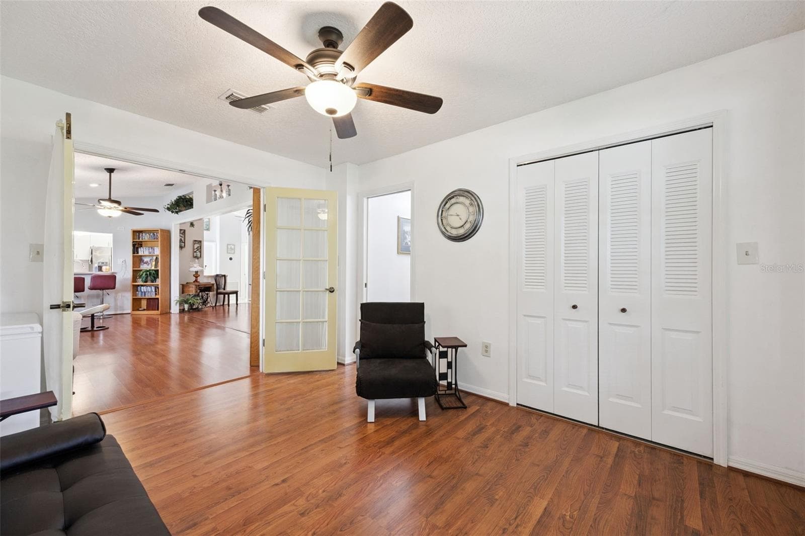 Bedroom 3 (13x11) with French door entry from the great room, and built-in closet in this Mount Dora home - 480 LAKE FOREST CIR, MOUNT DORA
