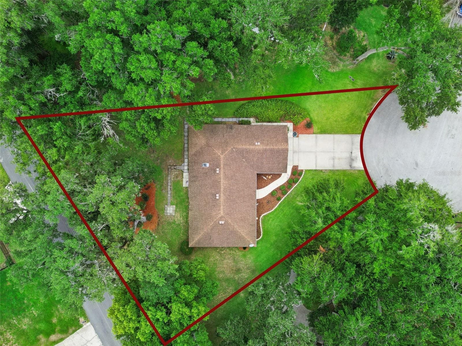 Aerial top-down view with lot boundaries showing the full 0.46-acre property on the cul-de-sac at 480 Lake Forest Cir, Mount Dora, FL 32757 - 480 LAKE FOREST CIR, MOUNT DORA