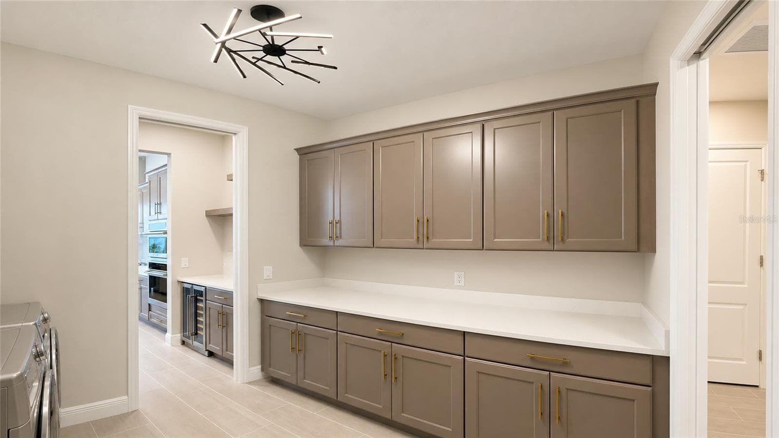 Laundry Room Provides Direct Assess From Mud Room to Butler’s Pantry for Ease & Convenieince - 812 BLUE SHELL LOOP, SARASOTA