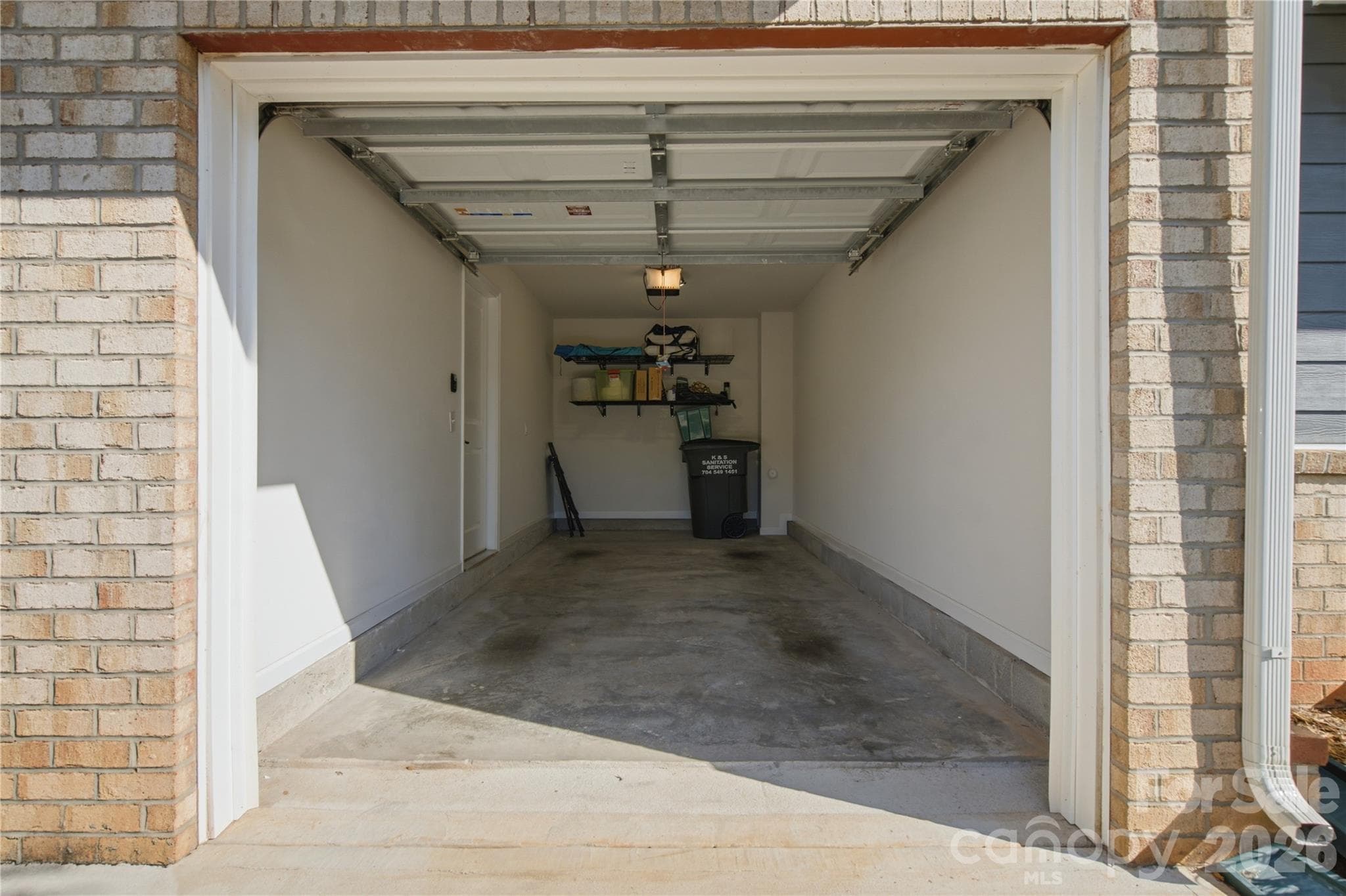 Deep garage with room for storage. Don't miss the finished painted walls and trim. - 4014 Edenborn Lane, Charlotte