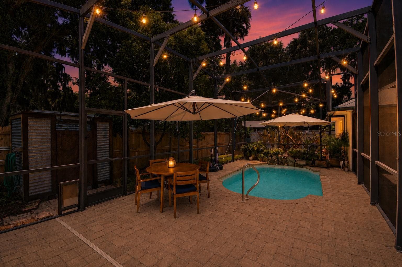 Enclosed backyard pool deck perfect for entertaining. - 1112 PALMETTO ST, NEW SMYRNA BEACH