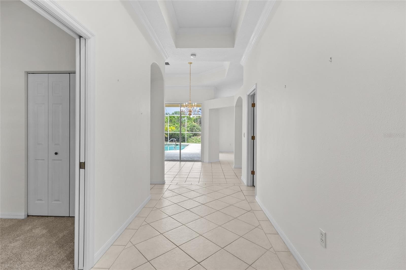 Front hallway with 3rd bedroom on left. - 125 RIO TERRA, VENICE