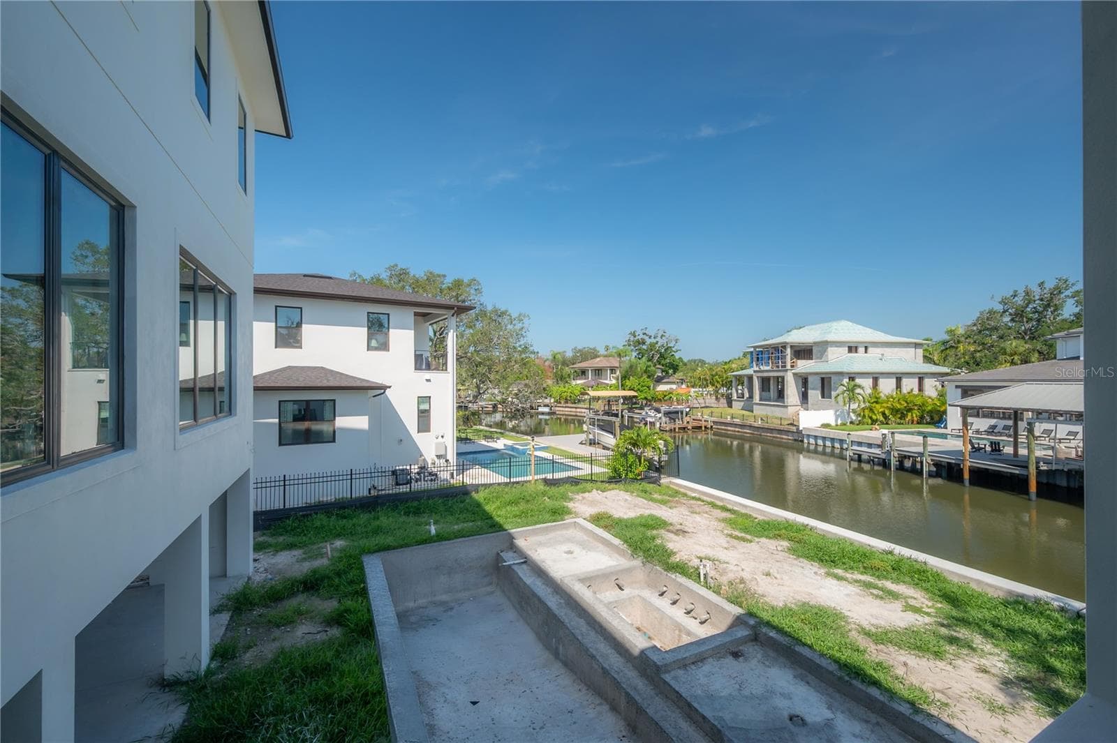 View of pool/Canal from Exterior Kitchen - 654 GENEVA PL, TAMPA