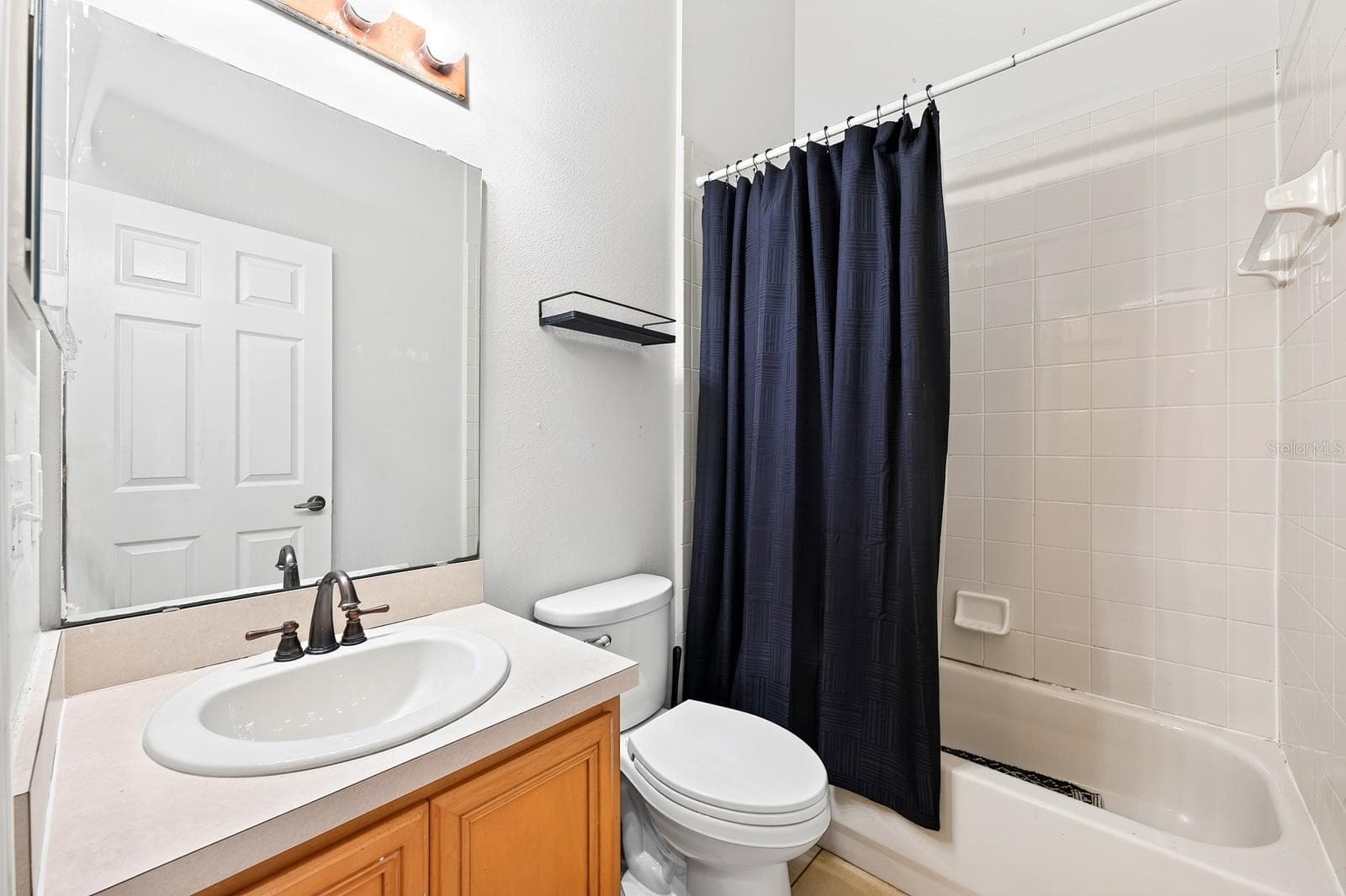 Third full bath. - 2551 WALNUT HEIGHTS RD, APOPKA