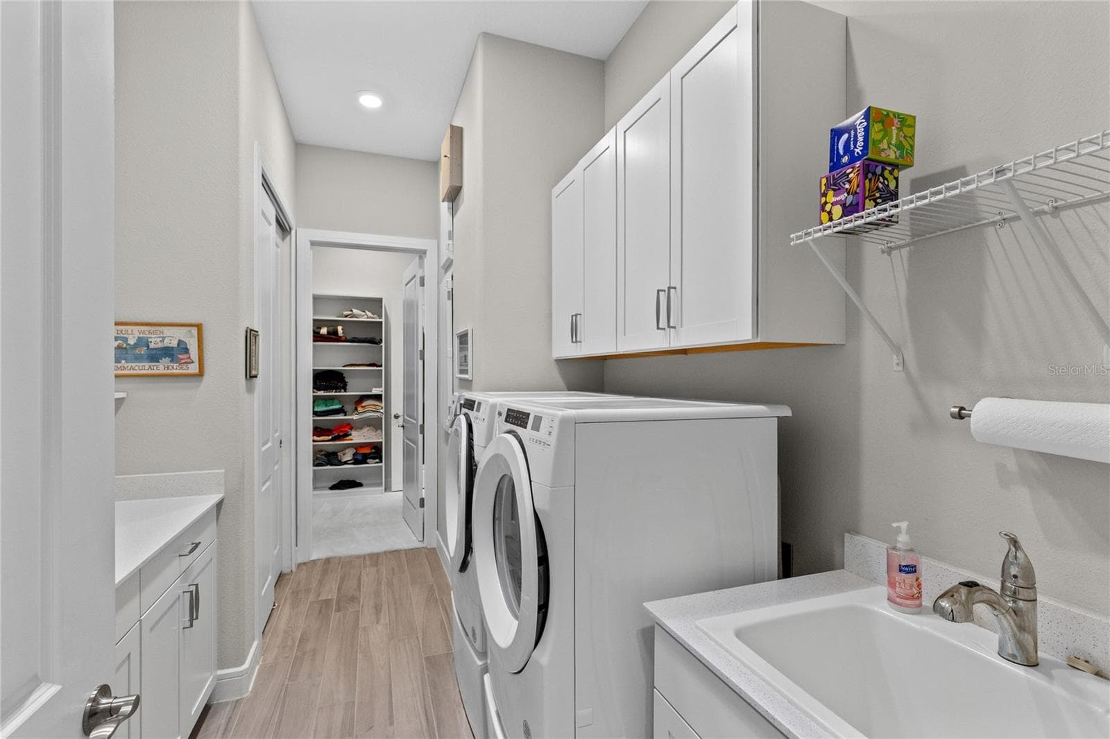 Laundry with built-in and sink. - 2865 CHERRY BLOSSOM LOOP, ST CLOUD