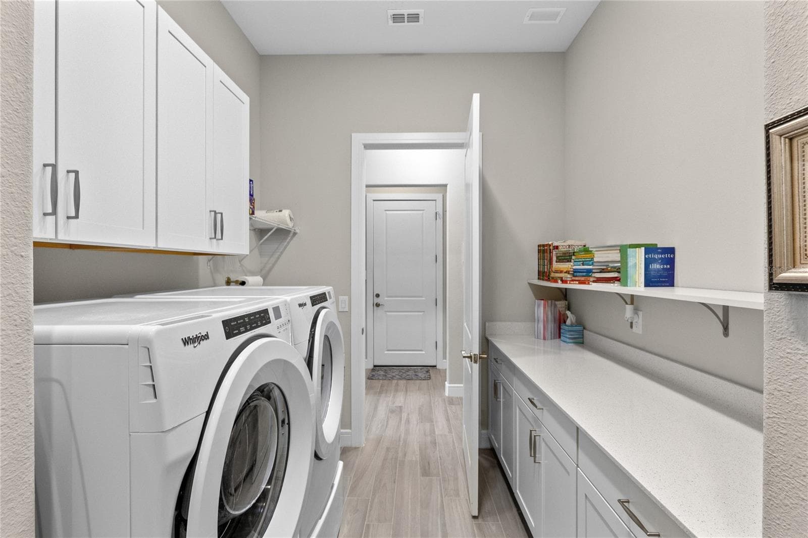 Laundry with built-in and sink. - 2865 CHERRY BLOSSOM LOOP, ST CLOUD