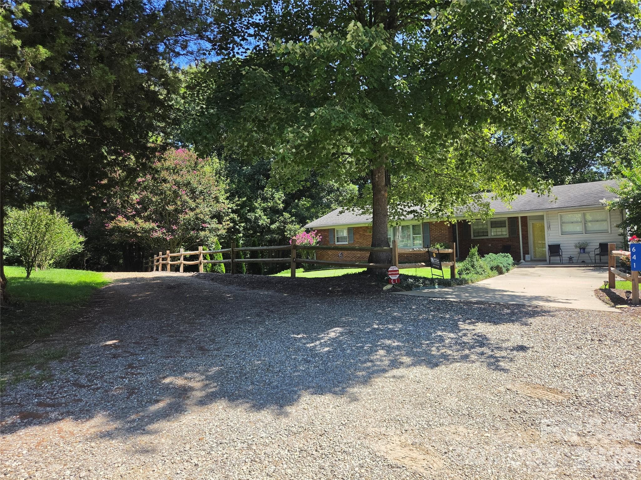 Access is gravel drive to left of split rail fence - 700 Nelson Lane, Millers Creek