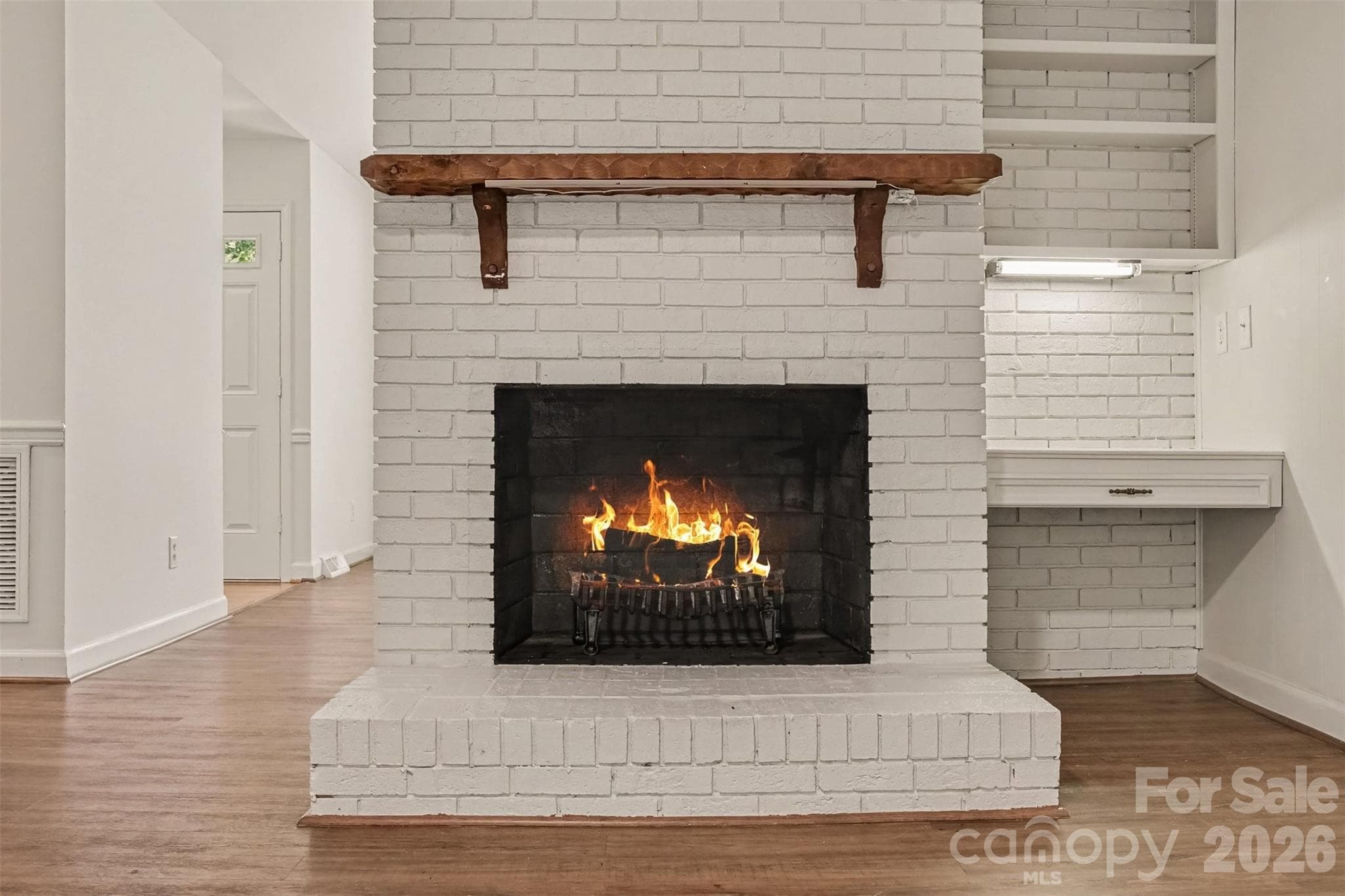 Yes, you'll have a wood-burning fireplace. And wouldn't that nook be great for the home bar? - 13520 Andulusian Drive, Matthews