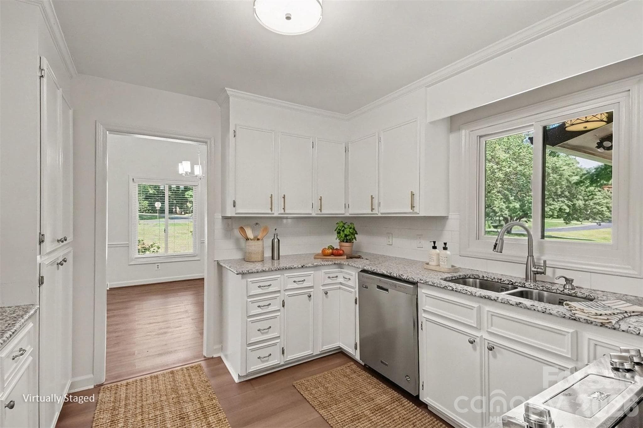 With granite countertops, stainless steel appliances and beautiful white cabinets. - 13520 Andulusian Drive, Matthews