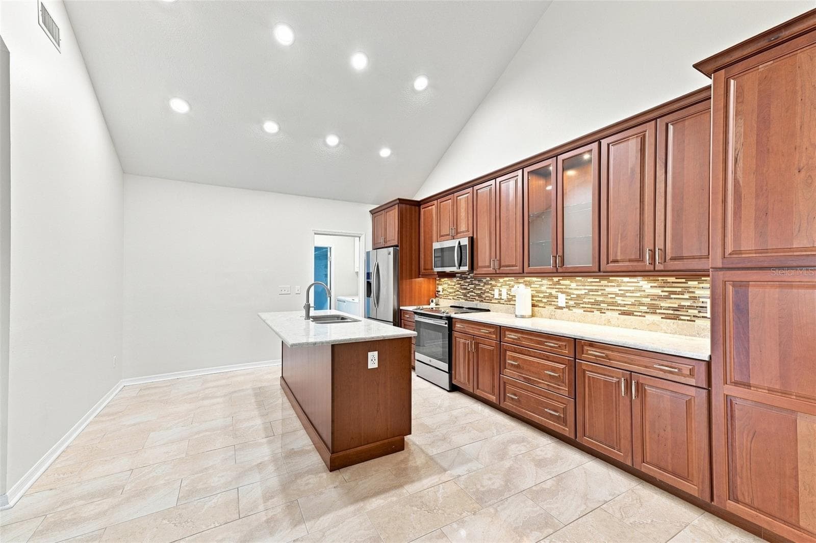 Kitchen is spacious and open to all the activity. - 1124 GOLFVIEW WOODS DR #na, SUN CITY CENTER