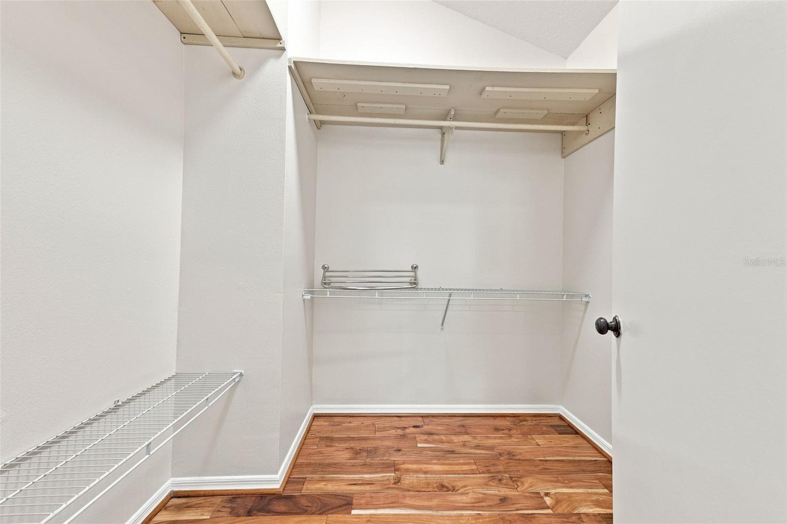 The walk in closet has lots of shelving and storage capacity. - 1124 GOLFVIEW WOODS DR #na, SUN CITY CENTER