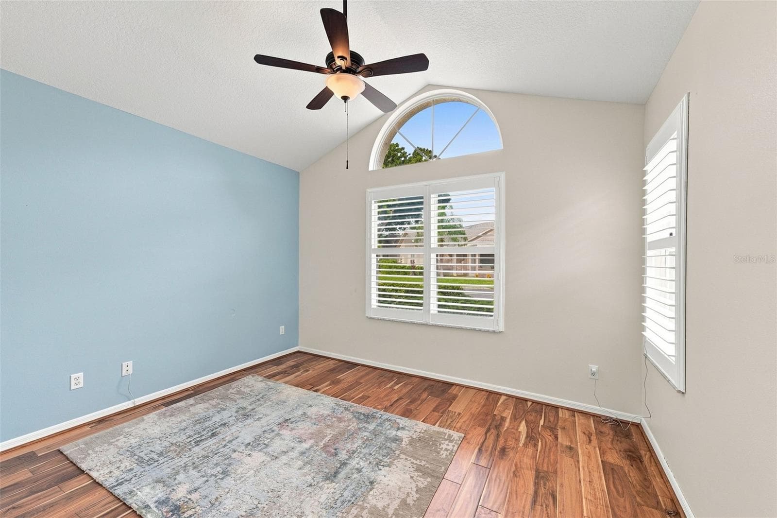 Second bedroom is on the other side of the house, with large windows and plantation shutters. - 1124 GOLFVIEW WOODS DR #na, SUN CITY CENTER