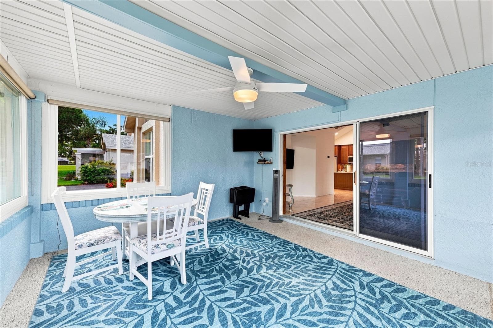 The Florida room is large with new windows, TV and ceiling panels for ultimate comfort. - 1124 GOLFVIEW WOODS DR #na, SUN CITY CENTER