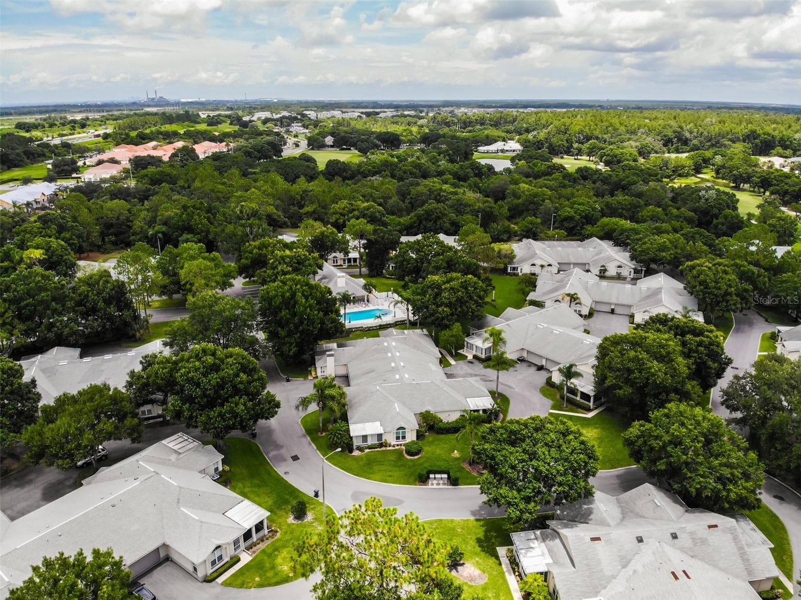 Aerial view of the community center with the pool and fitness center - 1124 GOLFVIEW WOODS DR #na, SUN CITY CENTER