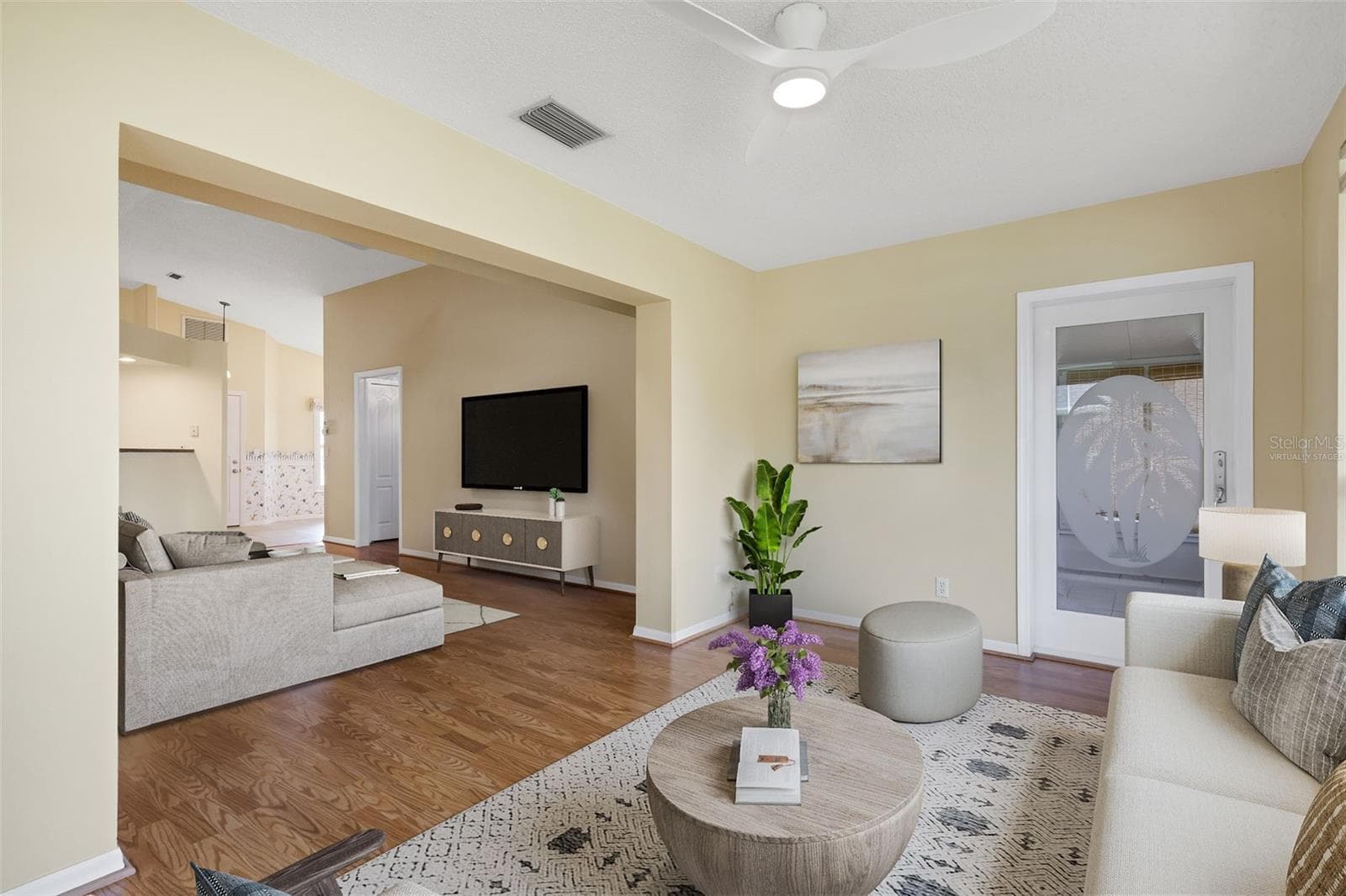 Virtually Staged Family Room looking into the Living Room. - 4430 FERN DR, BRADENTON