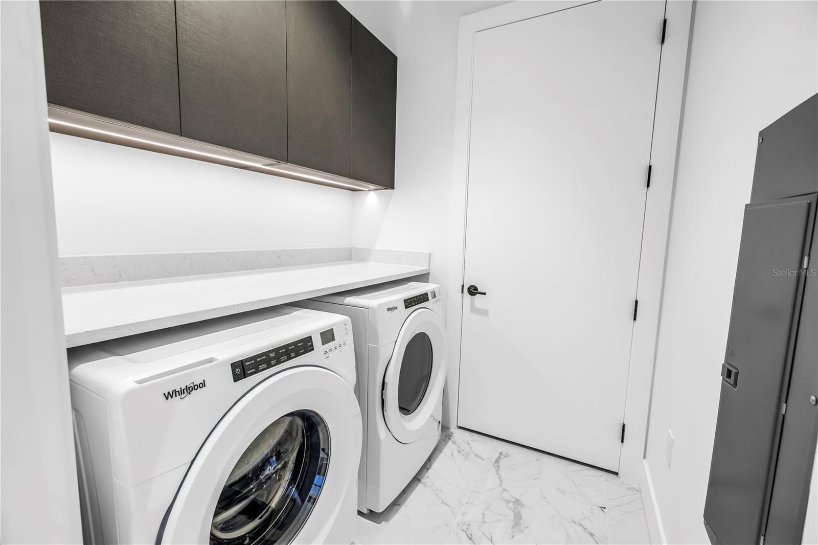 Laundry room with Whirlpool washer and dryer - 777 3RD AVE N #1704, ST PETERSBURG