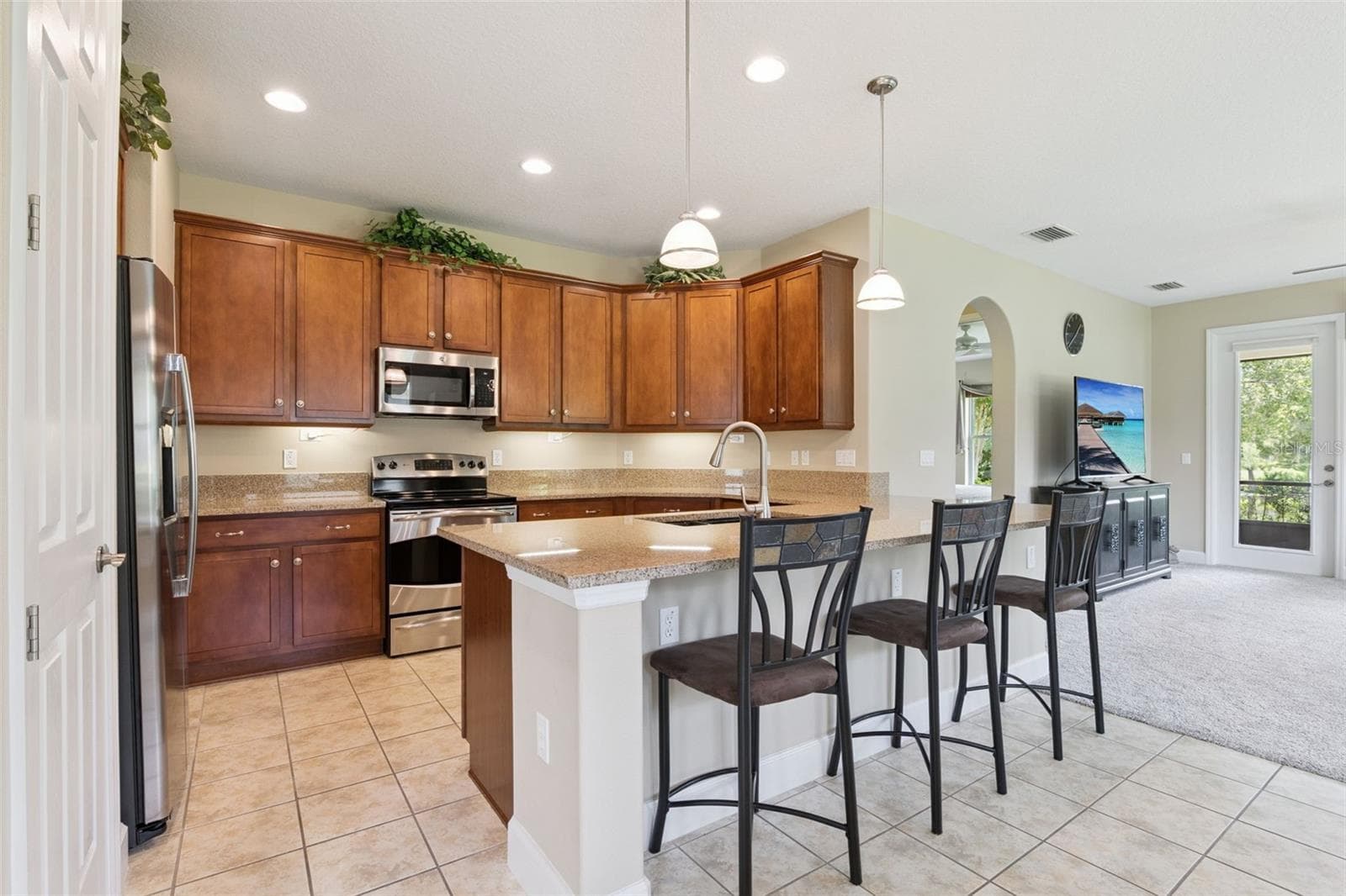 11' x 12' Kitchen w/ 42" Maple wood cabinets, under cabinet lighting, electric glass top range & granite countertops - 1381 ABBOT WAY, DELAND