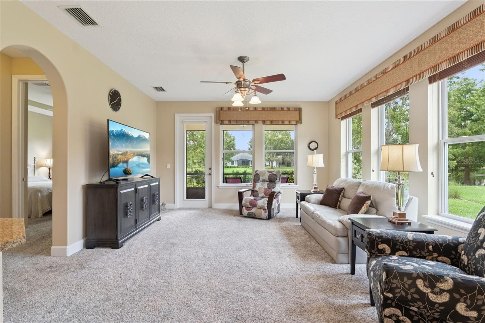 14'6" x 16'6" Great Room area w/ multiple windows & a ceiling fan - 1381 ABBOT WAY, DELAND