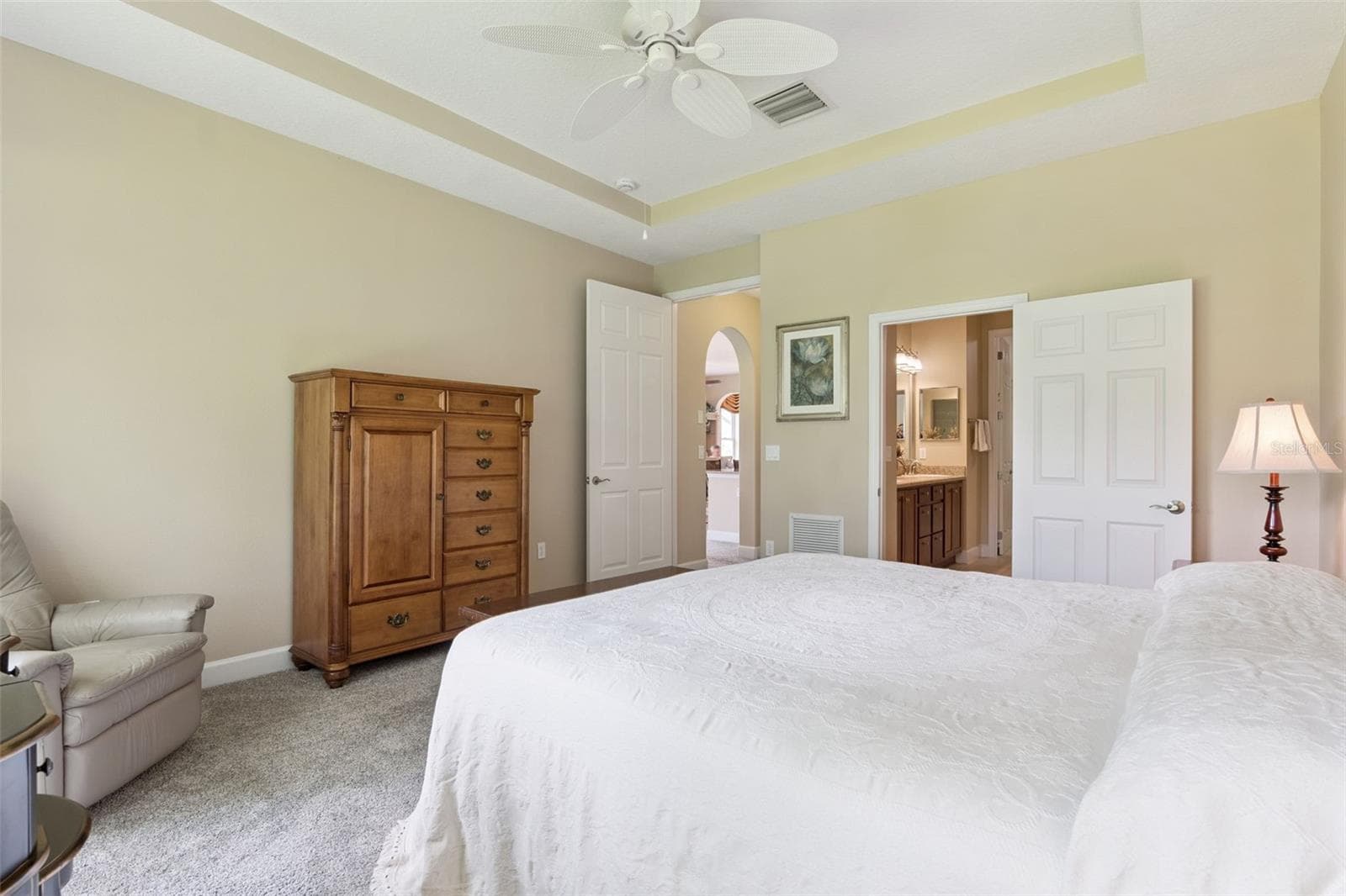 Primary Bedroom w/ a door to the en suite bathroom - 1381 ABBOT WAY, DELAND