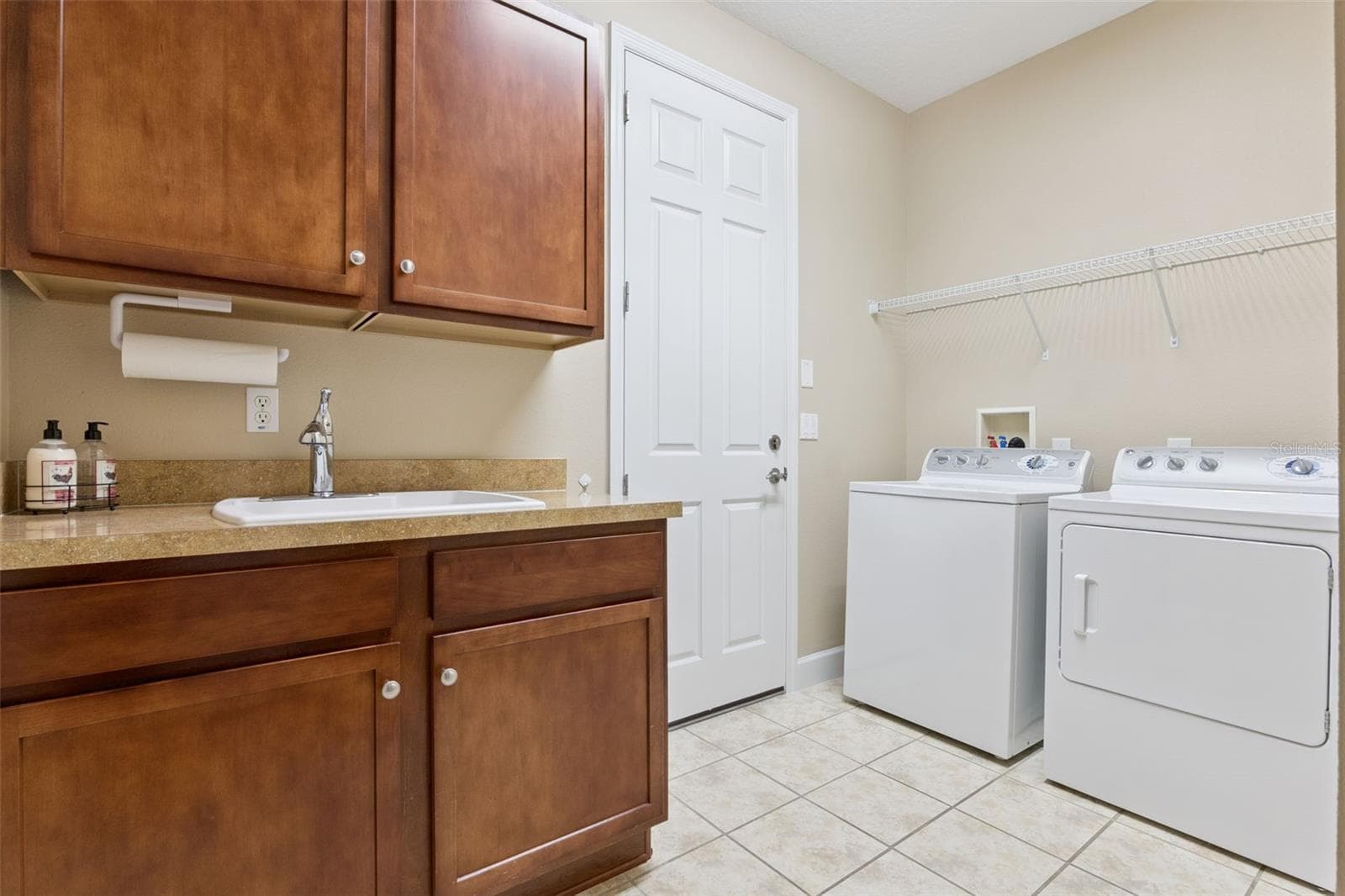 10'6" x 6' Laundry Room w/ built-in sink w/ washer & natural gas dryer - 1381 ABBOT WAY, DELAND