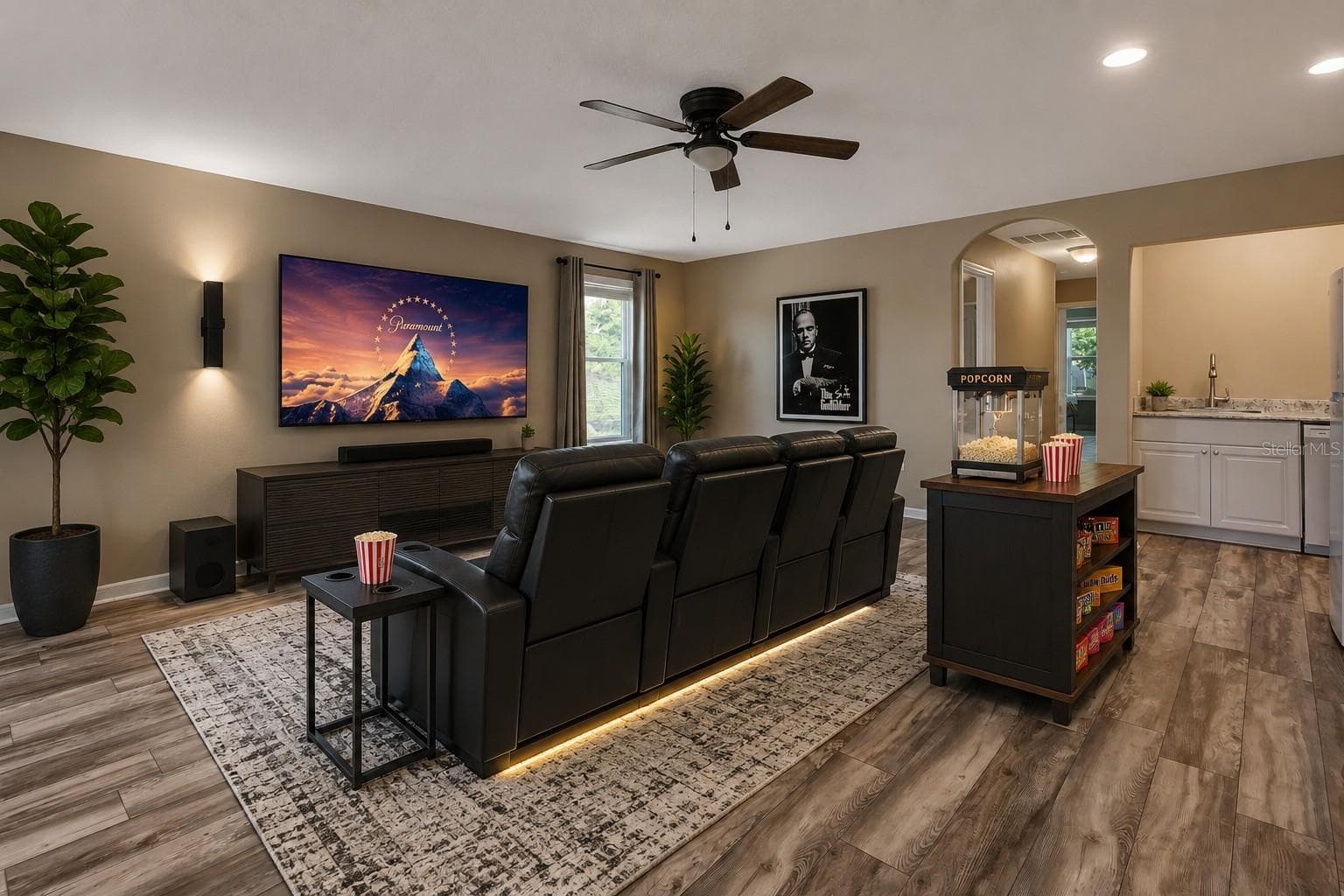 Staged home theater in bonus room - 337 ORCHARD HILL ST, DELAND